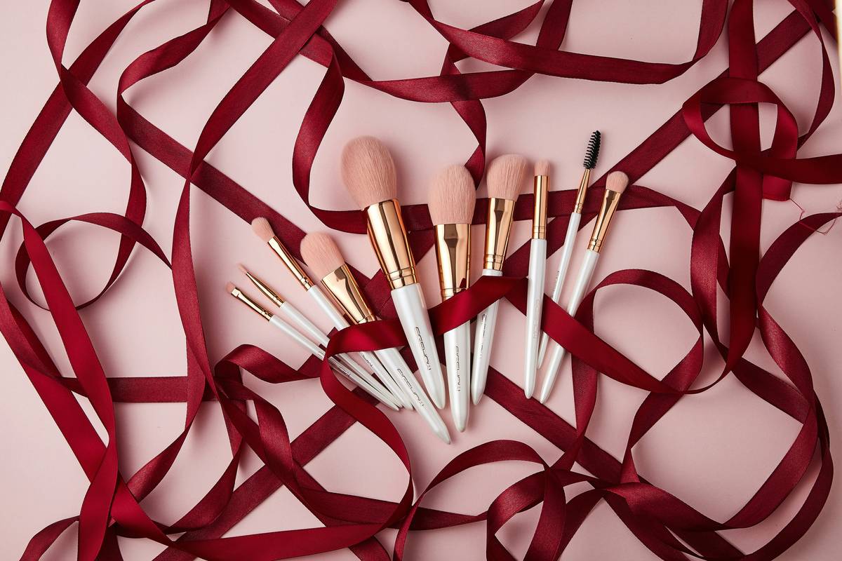 Comparison of different foundation applicator tools on makeup palette