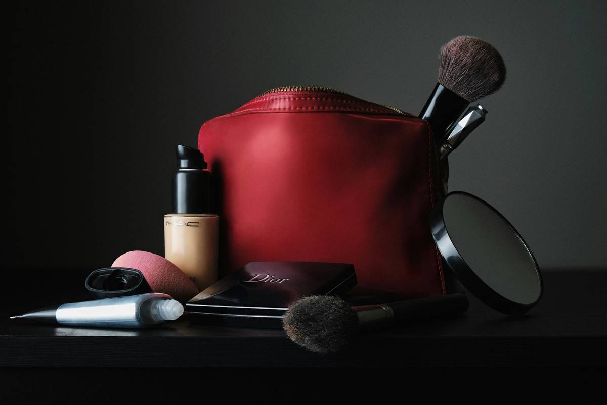 Close-up of clean makeup sponge tool held against natural light showing texture and bounce