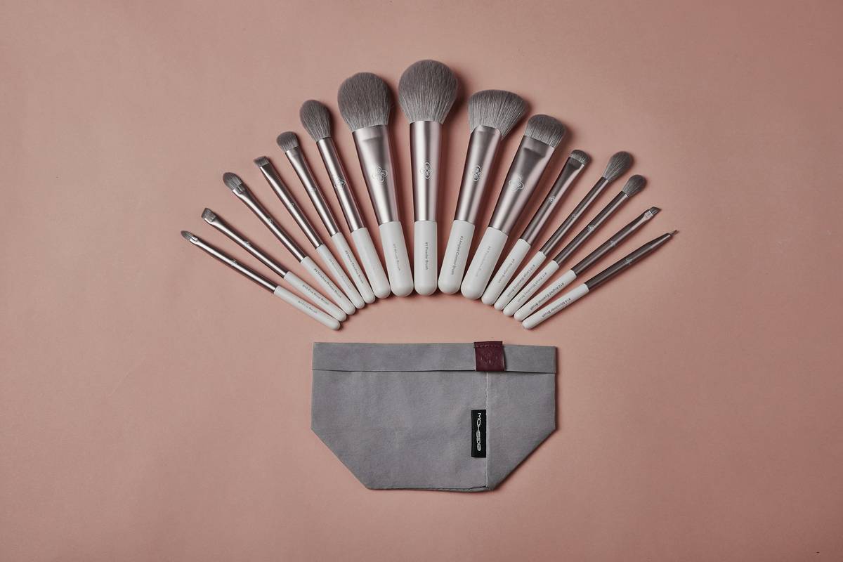 Close-up of a beauty contour tool blending cream product along jawline for seamless definition